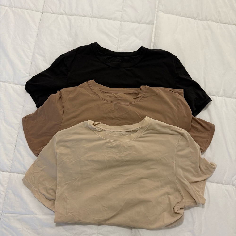 SKIMS Short Sleeve Tees - Black, Brown, and Tan